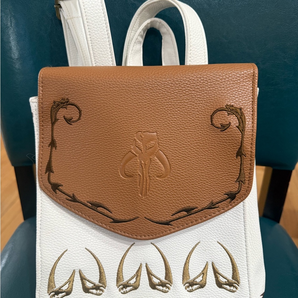 Danielle Nicole Brown and White Backpack